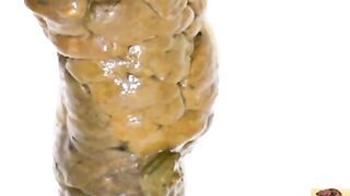 Wet shit protrudes from asshole close-up