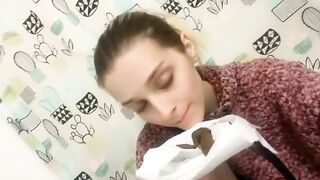 Woman eats a pile of shit on a toilet