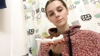 Woman eats a pile of shit on a toilet