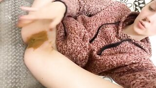 Woman eats a pile of shit on a toilet