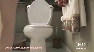 Girl squats over the toilet and takes a huge shit