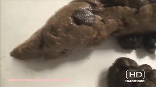 Girl squats over the toilet and takes a huge shit