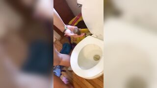 Two girls pull large shit out of ass