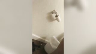 Girl sits in shit under plastic shower curtain