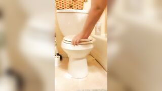 Girl spreads ass and shits on a toilet