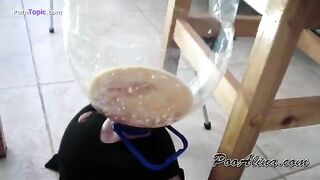 Woman shits in a bucket on her head
