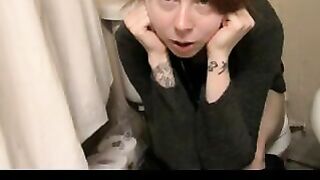 Woman squats over a toilet with her skirt up