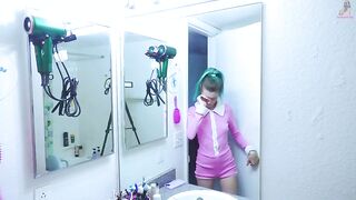 Girl brushes her teeth in the mirror