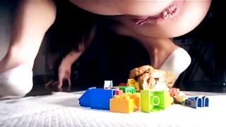 Teeny tot shits on her toys