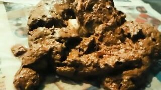 Blonde plays with a huge pile of shit