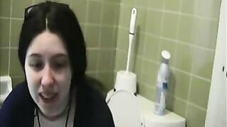 Woman sits on a toilet and takes a huge shit
