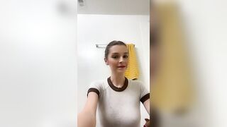 Woman pisses into her hand in the bathroom