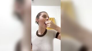 Woman pisses into her hand in the bathroom
