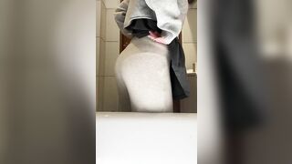 Girl squats in front of toilet while taking a massive shit