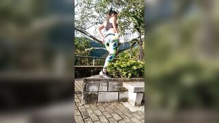 Babe takes a big shit on some bushes in public