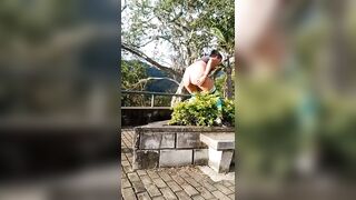 Babe takes a big shit on some bushes in public