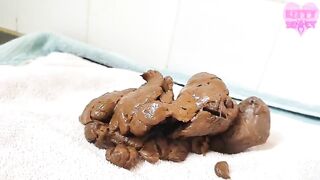 Woman lays on shit and spreads it on her body
