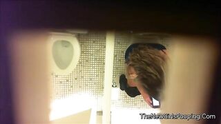 Babe squats over public toilet and takes a dump
