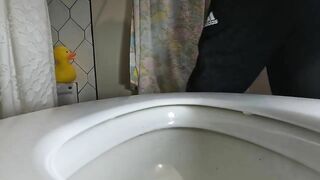 Woman drops a fat shit in a toilet