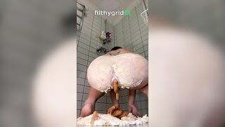 Woman fucks around in a huge pile of shit in the shower