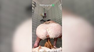 Woman fucks around in a huge pile of shit in the shower
