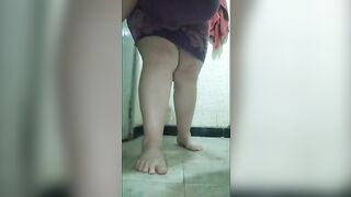 Babe squats over the toilet and poops