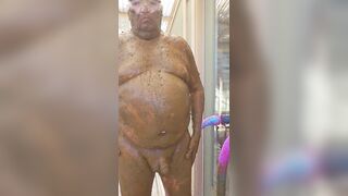 Man with a lot of shit on him cleans it off with a dildo