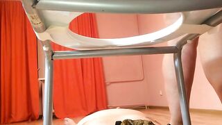 Girl squats in chair and takes a shit on a pillow