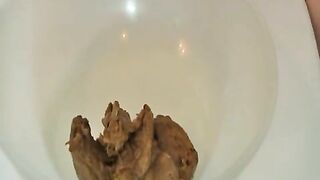 Girl reaches into her ass to pull out a shit-filled glove