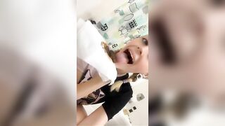 Woman holds shit in her hands and giggles