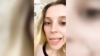 Woman holds shit in her hands and giggles