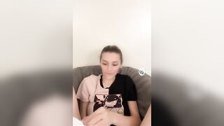 Woman holds shit in her hands and giggles