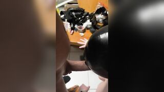 Girl lays on her side while a hand fucks her ass.