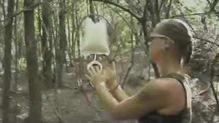 Women piss on each other in a forest