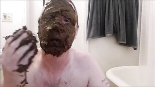 Man covers his head and face with shit