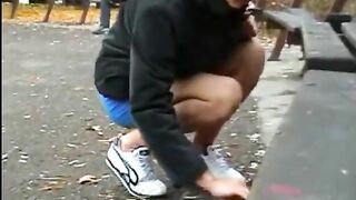Woman takes a huge shit on a park bench