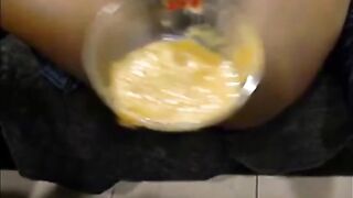 Girl squats over a bowl to shit