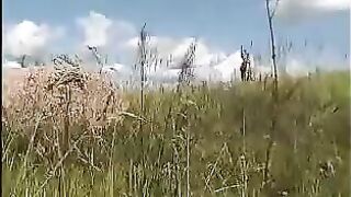 Woman takes a huge shit in the field while being filmed