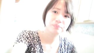 Girl in a pink dress squats to piss on the floor