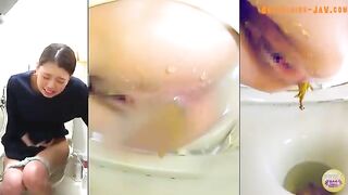 Girl smiles while taking a huge shit on the toilet