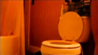 Young girl takes a shit on a toilet in an airplane bathroom