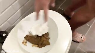Girl eats shit from a plate on a toilet