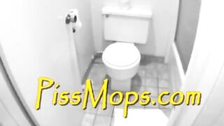Woman sits in a tub full of piss, a man stands nearby