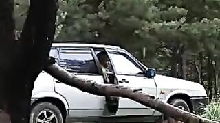 Girl in heels squats and pisses on the ground in the woods