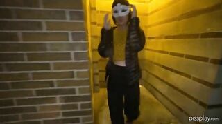 Babe drinks piss from a black garbage bag outside