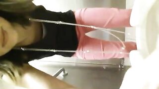 A person sits on the toilet and shits
