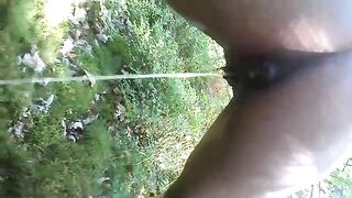 Girl squats and takes a huge shit on the grass