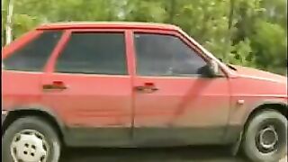 Chick pisses on the ground while squatting in the dirt