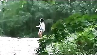 Girl squats and shits in the grass while being recorded