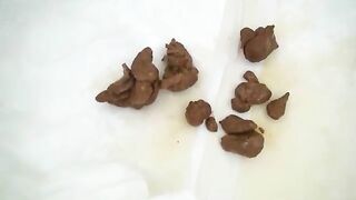 Girl plays with shit in the toilet and then eats it